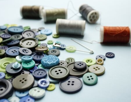 Why is a sewing kit considered an essential for camping?